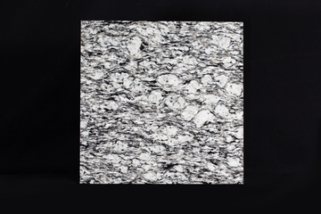 Granular polished black and white rock surface